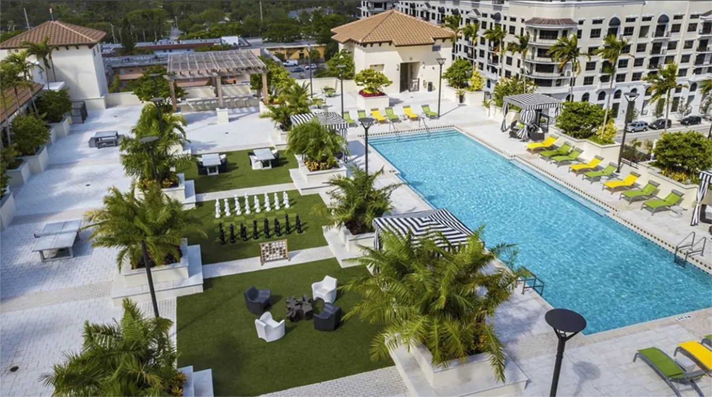 aerial view of the swimming pool area of a condominium building